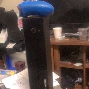 A black Xbox one in good condition come with controlling and games already on